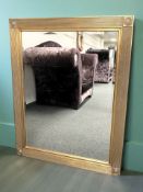 A modern gilt and bevelled overmantel mirror, 120 cm x 94 cm.