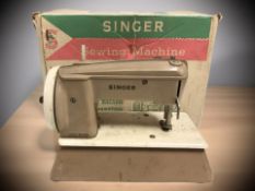 A child's Singer Sewhandy sewing machine with original box