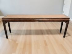 An early 20th century Chinese lacquered hardwood and wicker inset four drawer altar / side table,