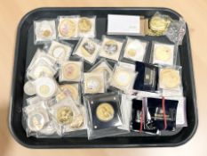 A collection of gold-plated commemorative coins and tokens including Royal Family etc,