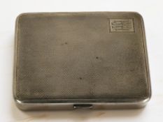A silver cigarette case with engine turned decoration, Birmingham marks.