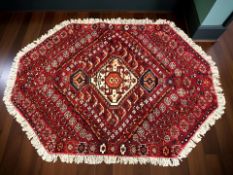 An octagonal wool rug of Iranian Khamseh design,