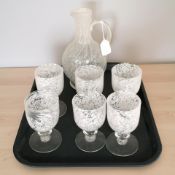 A mottled glass decanter and matching set of six goblets.