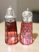 Two cranberry glass sifters, tallest 15.5cm.