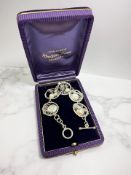 An ornate hand-crafted silver and pearl bracelet,