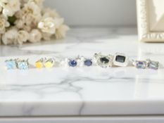 Several pairs of silver gem set earrings including mystic green topaz, blue topaz,