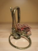 A brass Royal Welsh Fusiliers bugle and a vintage car horn lacking bulb.