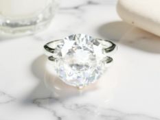 A large synthetic solitaire ring, size Q/R. CONDITION REPORT: Shank un-marked.