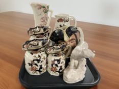 A Maling lustre jug, four Masons Blue Mandalay jugs,