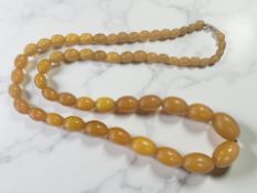 A butterscotch Bakelite bead necklace, length 86cm. CONDITION REPORT: 90.