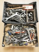 A quantity of hand tools including spanners, carpentry chisels, battery charger, etc.