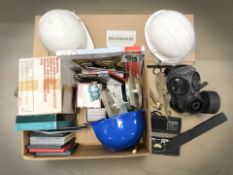 A gas mask, hard hats, Salters improved scales,