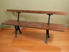 A cast metal and pine railway style bench, length 180 cm.