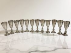 A set of twelve Jewish silver Kiddush cups, Birmingham 1916, height 8.