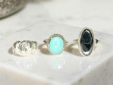 Three silver rings one set with turquoise (3) CONDITION REPORT: 12.