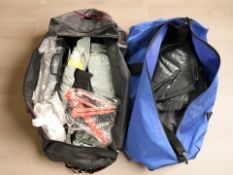 Two hold-alls containing a tent, ground sheet, etc.