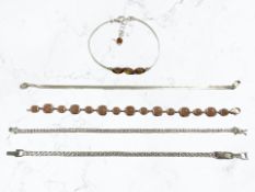 A silver and amber bracelet, a flat link bracelet,