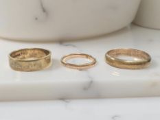 Two 9ct gold band rings and a further plated ring CONDITION REPORT: 9ct gold 6.3g.