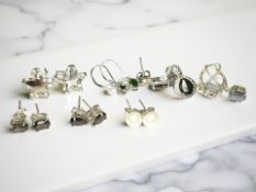 Several pairs of silver gem set earrings including green tourmaline,