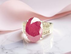 A 9ct yellow gold ruby ring set with diamond shoulders, size R CONDITION REPORT: 6.
