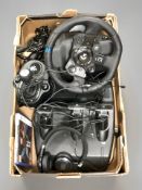 A gaming steering wheel, gear stick and pedals, pair of headphones, PS5 game.
