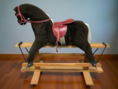 A Pegasus rocking horse, length 123 cm.