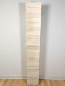 A laminated slim storage cabinet, 30 cm x 35 cm x 194 cm.