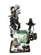 A golf bag containing assorted irons and drivers including Dunlop, a golf bag travel cover in box,