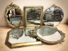 A group of gilt framed mirrors, largest 70 cm long.