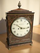 A Regency mahogany ebonised and brass mounted eight day bracket clock with twin fusee movement,