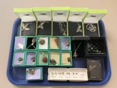 A collection of costume pendants and earrings, gemstone pendants set in white metal, etc.