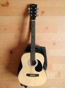 A Martin Smith acoustic guitar with carry bag.