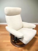 A Norwegian Ekornes stressless swivel lounge armchair in oatmeal fabric.