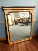 A continental satinwood mirror, 81 cm x 92 cm.