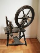 A stained beech spinning wheel.