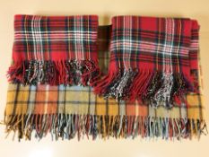 Three tartan blankets.