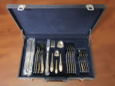 A canteen of Suissine stainless steel cutlery.