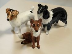 A Beswick collie, a Jack Russell and seated fox.