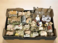A collection of unboxed Lilliput Lane cottages, glass and ceramic table bells.