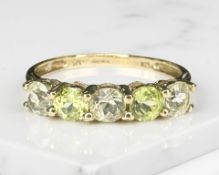 A 9ct gold five stone peridot ring, size M CONDITION REPORT: 1.
