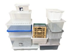A group of plastic storage boxes with lids, longest 80 cm.