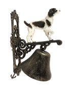 A cast metal spaniel wall bell on bracket, height 35 cm.