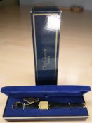 An Oleg Cassini gold plated quartz wristwatch, case 26 mm, in box.