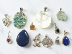 Several silver-mounted pendants including lapis lazuli, fire opal,
