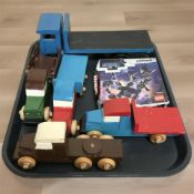 Five hand made wooden toy trucks and a LEGO Avengers set.