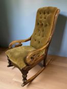 A mahogany rocking chair in buttoned draylon.