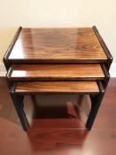 A nest of three Danish Drylund tables, width 60 cm.