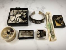 A decorative eastern white metal filigree bangle, together with a filigree brooch,