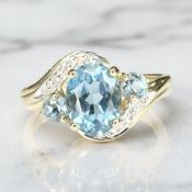 A 9ct gold blue topaz and diamond ring, size P CONDITION REPORT: 2.