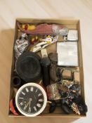 A small tray of collectibles including alarm clock,